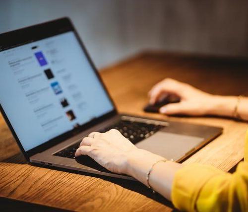 woman typing on laptop
